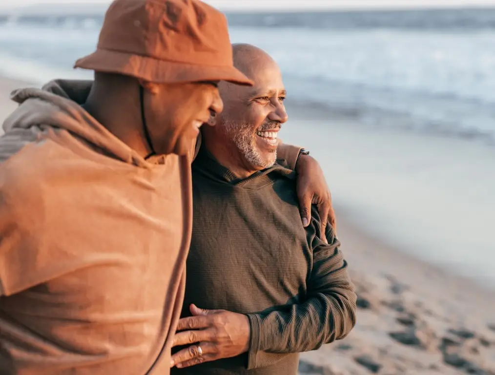 Senior gay couple on the beach