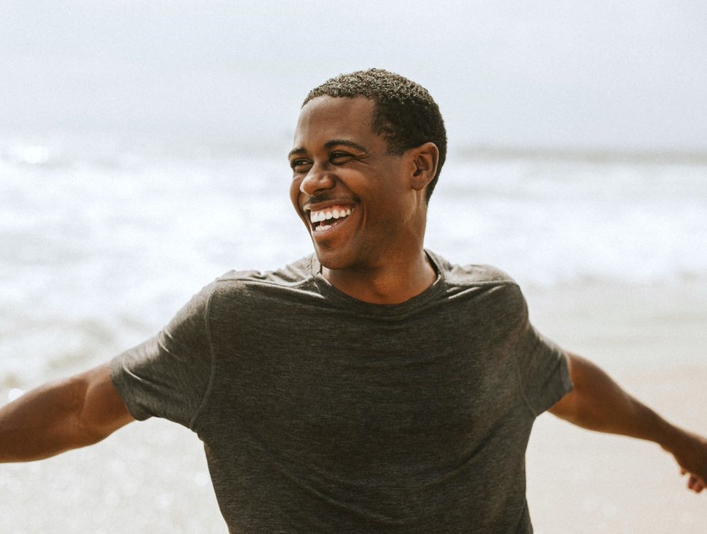 Cheerful man enjoying on the beach