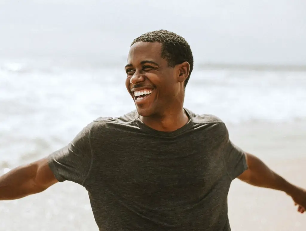 Cheerful man enjoying on the beach